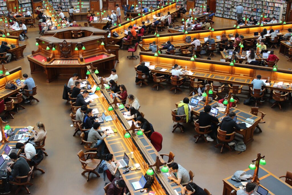 an image of students working in a library to demonstrate their potential in driving innovation in education